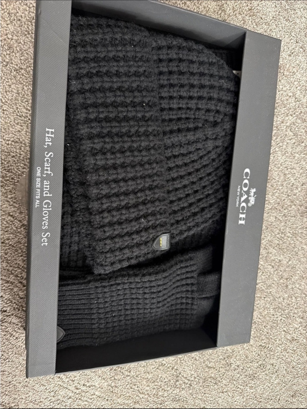 Coach waffle-knit hat, scarf, and gloves winter gift set with a textured pattern
